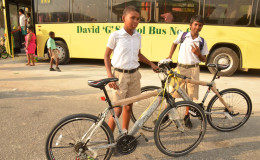 Two students pose with their new bicycles, which they received under the 5 Bs' programme.  The bicycles were donated by Denar Trading.  (Ministry of the Presidency photo)