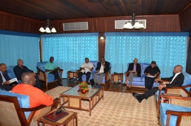 President David Granger (right) in discussions with his ministers today. (Ministry of the Presidency photo)