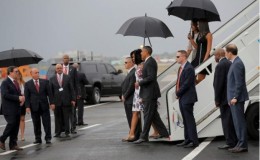 U.S. President Barack Obama and his wife Michelle approach Cuba's foreign minister Bruno Rodriguez (L) as they arrive at Havana's international airport for a three-day trip, in Havana March 20, 2016.
Reuters/Carlos Barria