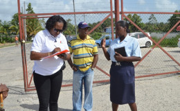 Minister within the Ministry of Public Infrastructure, Annette Ferguson (left) interacting with some of the employees of the Supenaam stelling in Essequibo (GINA photo)