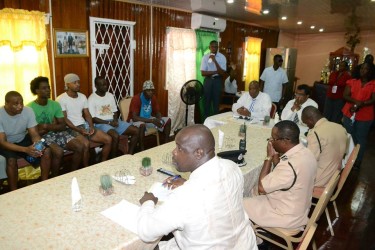 Minister of State, Joseph Harmon (sitting left) and Minister of Public Security, Khemraj Ramjattan meeting with the prisoners at the Prison Officers' Hall, Georgetown Prison earlier today. (Ministry of the Presidency photo)
