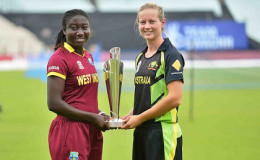 West Indies Women’s captain Stafanie Taylor (left) and Australia Women’s captain Meg Lanning pose with the Twenty20 World Cup trophy. (Photo courtesy WICB Media)
