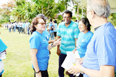 First Lady, Sandra Granger (left) in a warm exchange with Minister of Public Security, Khemraj Ramjattan (second from left) and his wife, Seeta Ramjattan and Minister of Education, Dr. Rupert Roopnaraine on her arrival at the Promenade Gardens. (Ministry of the Presidency photo)
