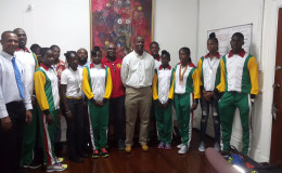 Permanent Secretary in the Department of Sport, Alfred King, poses with the CARIFTA Games representatives and officials of the AAG following a courtesy call on Friday.