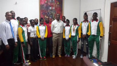 Permanent Secretary in the Department of Sport, Alfred King, poses with the CARIFTA Games representatives and officials of the AAG following a courtesy call on Friday.