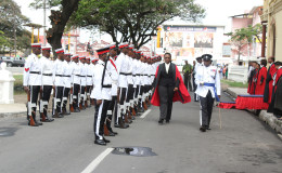 Justice Jo-Ann Barlow inspecting the guard of honour during yesterday’s opening ceremony of the new Demerara Criminal Assizes at the High Court. 