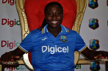 Stafanie Taylor, the West Indies Women cricket team captain, sits on the ‘throne’ during a welcome-home reception inside the Pineapple Lounge at the Norman Manley International Airport on Wednesday.
