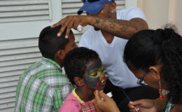 Children getting their faces painted. (Photo by Kellon Ferrier)
