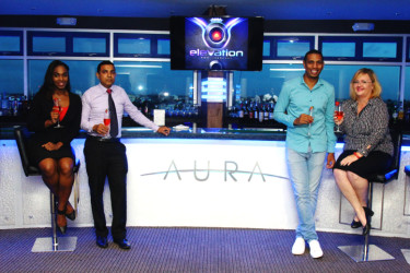 General Manager of the Pegasus Hotel Susan Isaacs (right) and newcomer to the Pegasus team Andre Rochford (second, right) along with other representatives of the hotel pose for a photo at the Aura Bar and Lounge. 