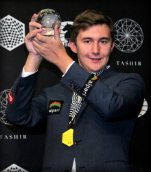 A smiling Sergey Karjakin showcases his trophy proudly as the winner of the 2016 Candidates Chess Tournament. With this victory, Karjakin earned the opportunity to oppose world chess champion Magnus Carlsen in a one-on-one match for the title in New York in November.