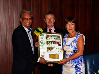 Head of the team, Baroness Dawn Primarolo receives a token of appreciation from Minister of Education, Dr. Rupert Roopnaraine at the end of the session at the Ministry of the Presidency. Nigel Evans, another member of the delegation is at the centre. (Ministry of the Presidency photo) 