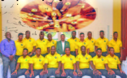 The Guyana Jaguars team pose with GCB Secretary Anand Sanasie (center) and James Bond NSC representative. (Orlando Charles photo)