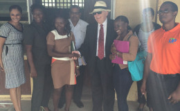 High Commissioner Pierre Giroux (with hat) with the Fort Ordnance Primary School Head Teacher, CDC Director General, Colonel Chabilall Ramsarup (Ret’d), and parents of some of the students (Canadian High Commission photo)