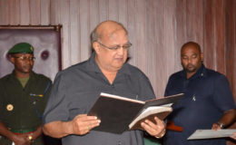 Dr. Carl Hanoman taking his Oath to Office before President David Granger. (Ministry of the Presidency photo)
