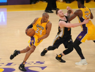 Los Angeles Lakers forward Kobe Bryant (24) moves the ball as center Roy Hibbert (17) provides a screen against Utah Jazz forward Gordon Hayward (20) during the second half at Staples Center. Gary A. Vasquez-USA TODAY Sports
