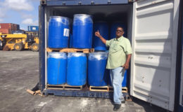  Mohan Jagnarine alongside his container of ‘pepper mash’ ready for shipping to Jamaica
