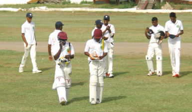 The U17 boys walking off after being dismissed for a 1st innings 243. (Orlando Charles photo) 
