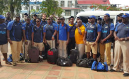 The Barbados national 15s rugby outfit pose for a photo before checking into the Sleep In Hotel yesterday afternoon. 