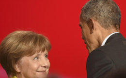U.S. President Barack Obama speaks to German Chancellor Angela Merkel during the opening ceremony of the Hannover Messe in Hanover, Germany April 24, 2016. REUTERS/Nigel Treblin