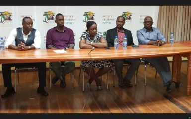 Minister within the Ministry of Education Nicolette Henry (centre) addressing the gathering at the forum while Alex Bunbury (left), NSC Director Christopher Jones (2nd left), GFF President (2nd right) and Sam Bunbury (right) looks on 
