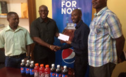 President of the GBA, Steve Ninvalle receives timely sponsorship from Larry Wills, Manager of the Pepsi brand yesterday ahead of the Caribbean’s first Schoolboys and juniors tournament is staged here tomorrow and Saturday at the Cliff Anderson Sport Hall.