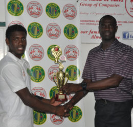 At Everest, Keemo Paul collects his Man-of-the-Match award from ex-Guyana and West Indies pacer, Match Referee Reon King.