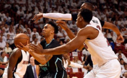 Charlotte Hornets guard Courtney Lee (1) is pressured by Miami Heat center Hassan Whiteside (21) and Miami Heat guard Dwyane Wade (3) during the first half in game five of the first round of the NBA Playoffs at American Airlines Arena. Mandatory Credit: Steve Mitchell-USA TODAY Sports