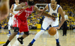 Golden State Warriors guard Shaun Livingston (34) controls the ball against Houston Rockets guard James Harden (13) during the third quarter in game five of the first round of the NBA Playoffs at Oracle Arena. Kelley L Cox-USA TODAY Sports
