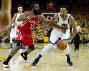 Golden State Warriors guard Shaun Livingston (34) controls the ball against Houston Rockets guard James Harden (13) during the third quarter in game five of the first round of the NBA Playoffs at Oracle Arena. Kelley L Cox-USA TODAY Sports 