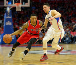 Los Angeles Clippers guard Austin Rivers (25) guards Portland Trail Blazers guard Damian Lillard (0) in the first half of game five of the first round of the NBA Playoffs at Staples Center. Mandatory Credit: Jayne Kamin-Oncea-USA TODAY Sports 