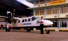 Roraima’s 18-seater Trislander Aircraft with Captain Gerry Gouveia (Jr) standing next to it.