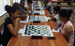 Christ Church Secondary School student Nellisha Johnson (left), ponders as she decides on her next best move against University of Guyana graduate and the Ministry of Housing’s Shazeeda Rahim during the Engineering and Construction Incorporated (ECI) chess tournament. Nellisha resides in Orealla, some 60 miles up the Corentyne River and learnt chess in her village four years ago. She won the trophy for the Best Junior Female player in the ECI competition. (Chess photos by Ryan Singh)
