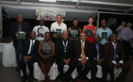  President David Granger, (seated third from left) along with the recipients of the awards along with the top brass of the GOA pose for a photo following the Appreciation and Award Ceremony at the Georgetown Club on Friday evening.
