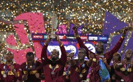 West Indies players celebrate with the trophy after winning the final. REUTERS/Adnan Abidi