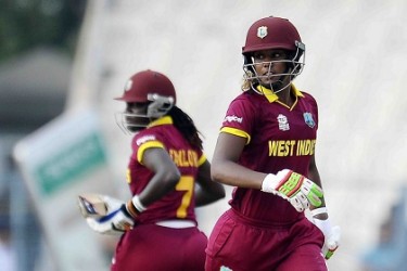 Openers Hayley Matthews (right) and captain Stafanie Taylor complete a run during their respective half-centuries during the final of the Twenty20 World Cup. (Photo courtesy WICB Media)