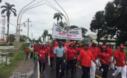 The marchers on Brickdam.  Among those at the front are veteran trade unionist Lincoln Lewis and Minister of Social Protection with responsibility for labour, Volda Lawrence.