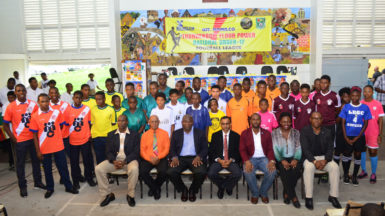 Members of NAMILCO including Financial Consultant Fitzroy McLeod (third from left) and the GFF executive committee including President Wayne Forde (third from right) pose with members of the participating clubs following the launch of the Thunderbolt Flour Power National Under-17 Intra-Association Football League last week. (Orlando Charles photo) 