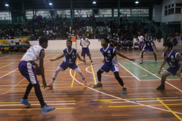 Action between Marian Academy and President’s College in the u-16 division of the NSBF Georgetown and East Coast Regionals at the Cliff Anderson Sports Hall Sunday.