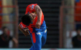 Shivil Kaushik in action in the IPL.
