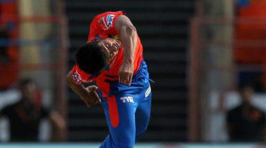 Shivil Kaushik in action in the IPL.