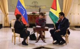 Guyana’s Ambassador to Venezuela Cheryl Miles (left) speaks with Venezuelan President Nicolás Maduro at her accreditation ceremony at the Miraflores Palace in Caracas.