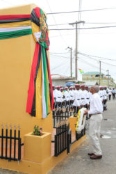 President David Granger about to lay a wreath yesterday at the restored cenotaph in the centre of Bartica, which was officially declared a town. (Photo by Keno George)