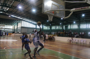 Marian Academy’s Jada Mohan (white) attempting a layup against St. Stanislaus College during their matchup at the Cliff Anderson Sports Hall in the National School Basketball Festival (NSBF) Georgetown & East Coast Regionals 