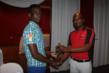 Tournament MVP Stanton Rose (left) collecting his accolade from Mackeson Brand Manager Jamaal Douglas during the presentation ceremony 