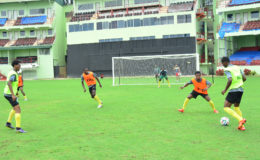 Members of the Golden Jaguars team going through an attacking drill at the National Stadium at Providence ahead of their clash with the Canadian Olympic team
