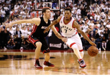 Toronto Raptors point guard Kyle Lowry (7) drives to the basket past Miami Heat point guard Goran Dragic (7) in game five of the second round of the NBA Playoffs at Air Canada Centre. The Raptors beat the Heat 99-91. Tom Szczerbowski-USA TODAY Sports