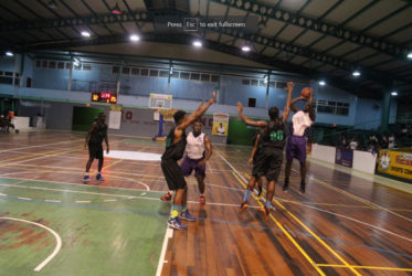 Jaleel Duke of President’s College attempting a jump shot against St. Rose’s High during their matchup of the National Schools Basketball Festival (NSBF) Georgetown and East Coast Regionals at the Cliff Anderson Sports Hall.    