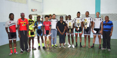 The prize winners of this year’s 34th Independence Three-Stage Cycle Road Race posing with Minister within the Ministry of Education, Department of Culture and Sport, Nicolette Henry, and organisers of the event. (Orlando Charles photo) 