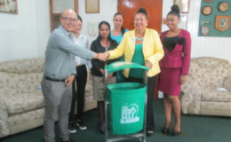 In photo, Mayor Chase-Green (second from right) receives the bins from a representative from the Association of Chinese Entrepreneurs.