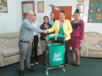 In photo, Mayor Chase-Green (second from right) receives the bins from a representative from the Association of Chinese Entrepreneurs.